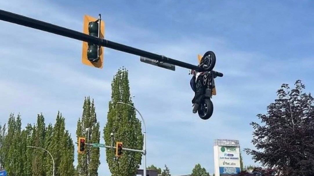 motorcycle-hanging-from-traffic-light