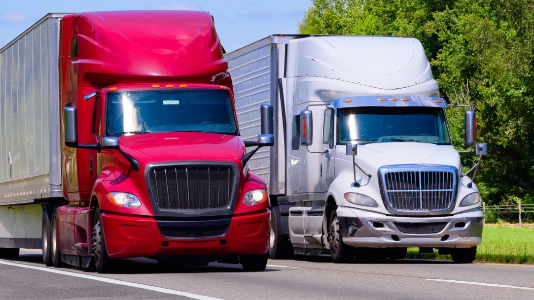 semi-trucks-hogging-both-lanes-of-highway