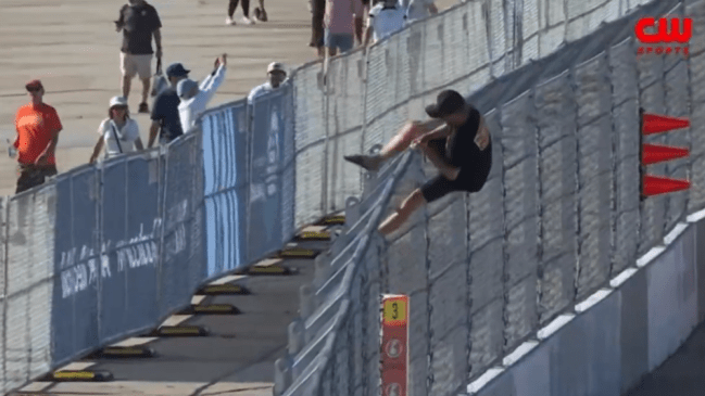 NASCAR fans climbs onto track during O'Reilly Auto Parts Series race at Coronado Naval Base in San Diego on June 20, 2026