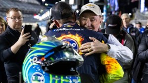 Richard Childress and Kyle Busch hug NASCAr