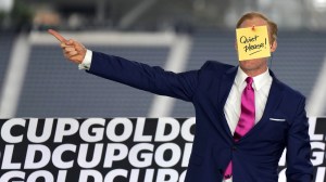 Alexi Lalas pointing at quiet please sign
