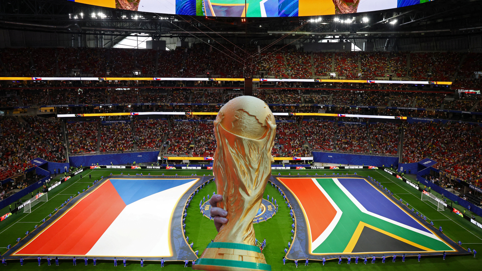 FIFA World Cup Trophy next to flags of Czech Republic v South Africa