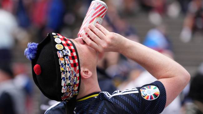 Scottish soccer fan drinking beer
