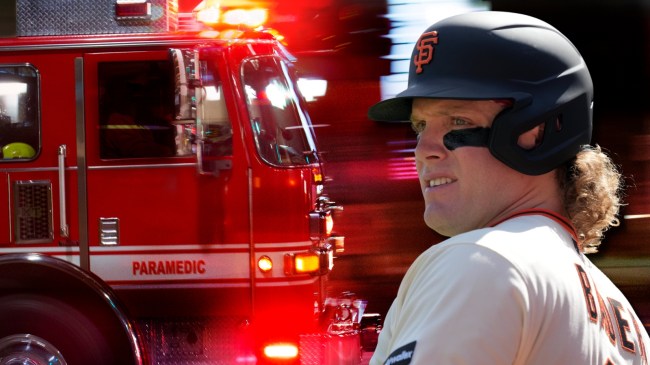 Giants outfield Harrison Bader next to fire truck