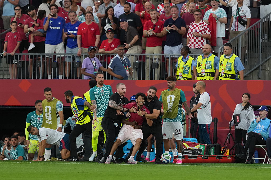 Cristiano Ronaldo streaker pitch invader world cup security tackle