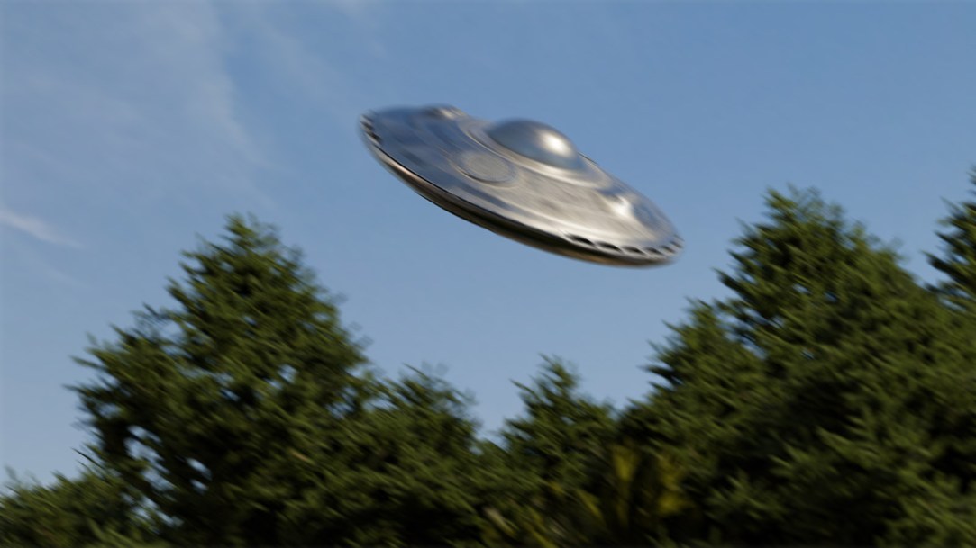 ufo-flying-over-forest