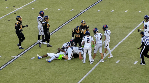 A tackle between in the annual Cocoa Bean football game between Hershey High School and the Milton Hershey School