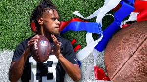 Taulia Tagovailoa next to flag football equipment