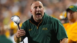 North Dakota State football coach Tim Polasek holding a driver