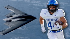B-2 bomber next to Air Force football player