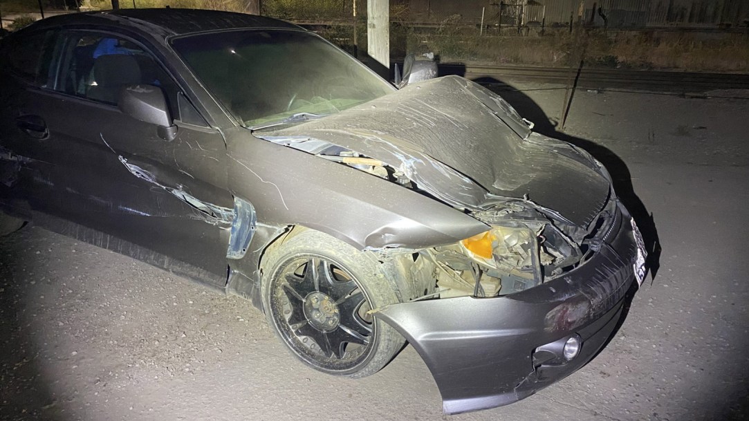 car-crushed-by-tractor