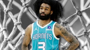 Hornets guard Coby White over basketball net