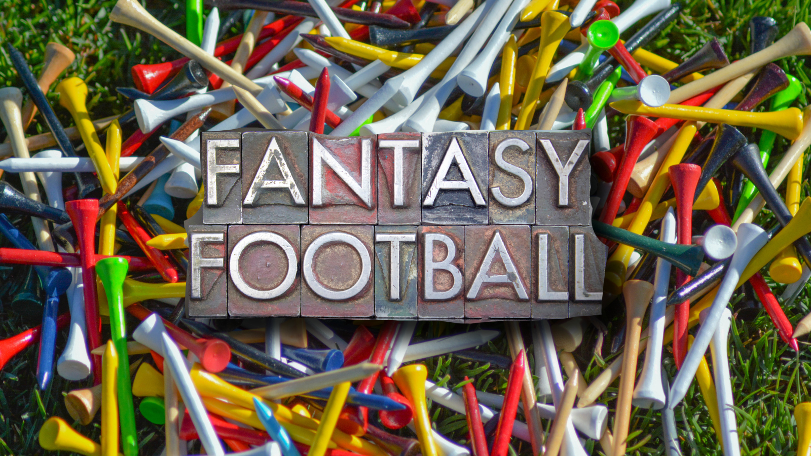 fantasy football sign over golf tees