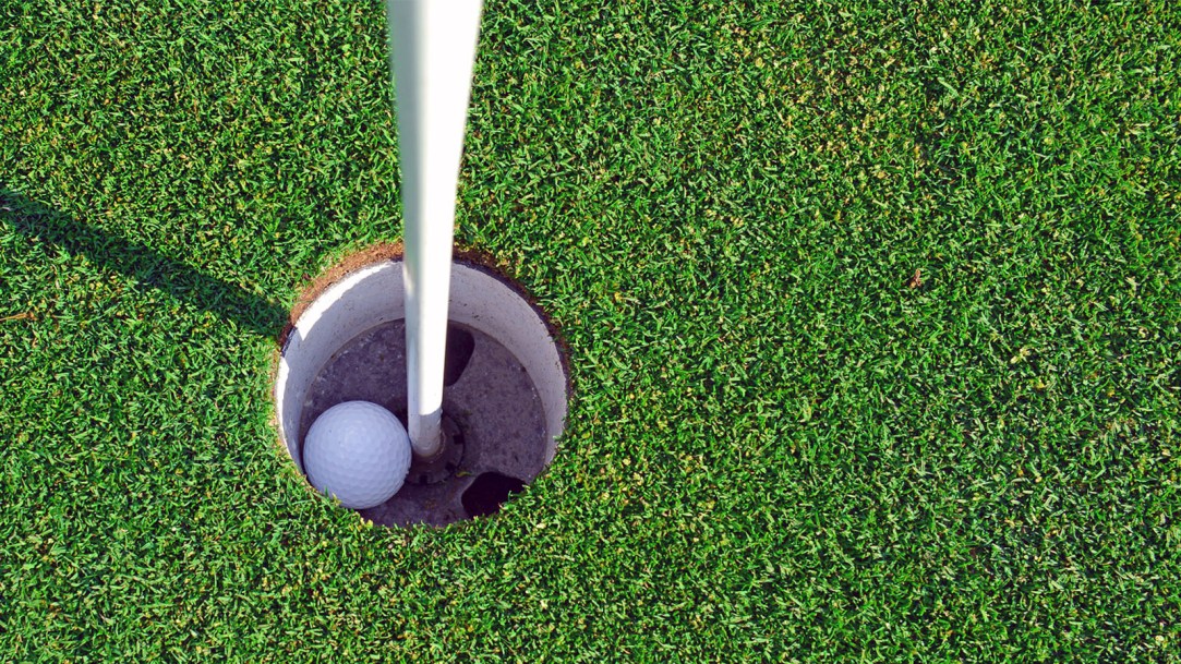 hole-in-one-golf-ball-and-flagstick