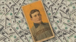 Honus Wagner baseball card over hundred dollar bills