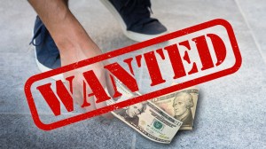 Wanted sign over man picking up $30