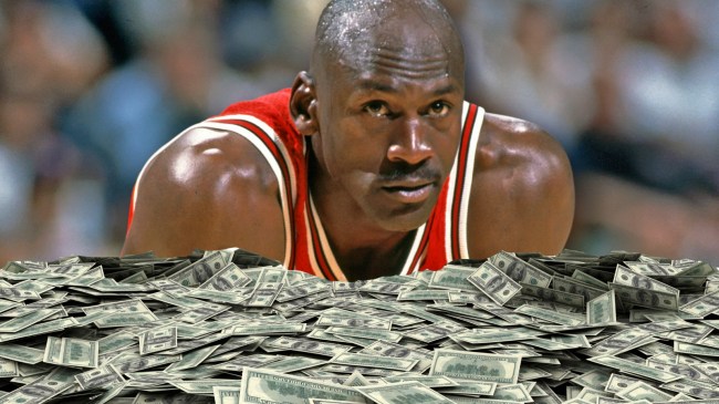 Michael Jordan over giant piles of hundred dollar bills