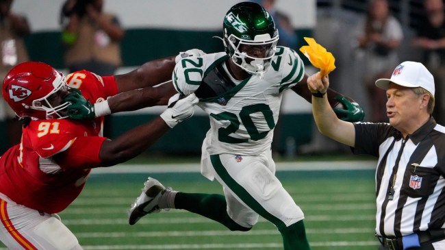 NFL referee with penalty flag
