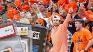 Sports cards next to Auburn Tigers basketball fans