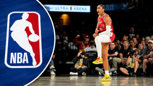 Aug 20, 2026; Las Vegas, Nevada, USA; Las Vegas Aces center A'ja Wilson (22) reacts after scoring against the Connecticut Sun during the third quarter of a WNBA basketball game at Michelob Ultra Arena. A photo of the NBA logo on has been added to the left side.