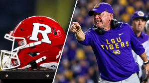 A photo of a Rutgers Scarlet Knights football helmet next to Louisiana State Tigers head coach Brian Kelly during the first half against the Texas A&M Aggies at Tiger Stadium.