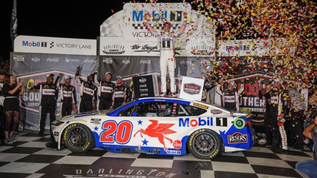 Christopher Bell celebrates in victory lane after NASCAR Cup Series race at Darlington.