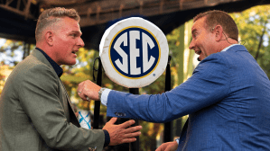 Pat McAfee greets Kirk Herbstreit before ESPN College GameDay starts ahead of the Ole Miss-LSU game in The Grove in Oxford, Miss., on Saturday, Sept. 19, 2026. Sep 19, 2026; College Station, Texas, USA; The SEC logo seen on a down chain.