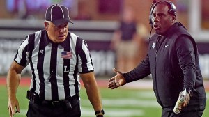 Middle Tennessee football coach Derek Mason speaking with referee