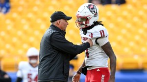 PITTSBURGH, PENNSYLVANIA - OCTOBER 25: Head Coach Dave Doeren and CJ Bailey #11 of the NC State Wolfpack celebrate prior to a game against the Pittsburgh Panthers at Acrisure Stadium on October 25, 2025 in Pittsburgh, Pennsylvania.