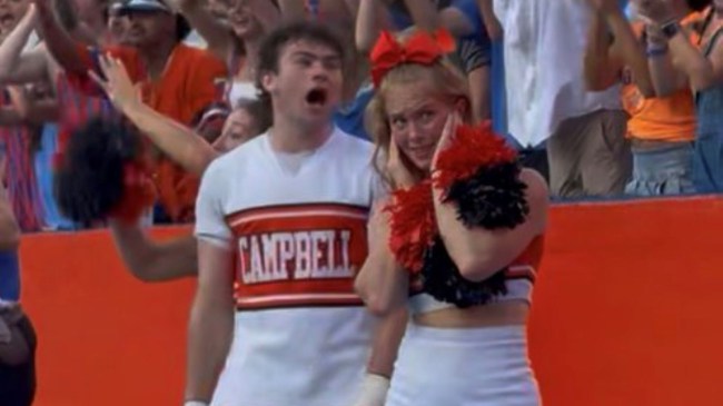 A Campbell Camels cheerlead covers her ears during against the Florida Gators in Ben Hill Griffin Stadium on Sept. 12, 2026.