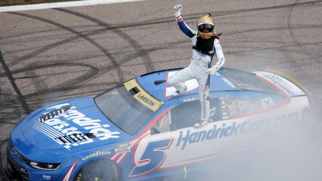 KANSAS CITY, KANSAS - SEPTEMBER 27: Kyle Larson, driver of the #5 HendrickCars.com Chevrolet, celebrates after winning the NASCAR Cup Series Hollywood Casino 400 at Kansas Speedway on September 27, 2026 in Kansas City, Kansas.
