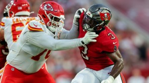 TAMPA, FLORIDA - AUGUST 22: Khalil Benson #70 of the Kansas City Chiefs blocks Rueben Bain #3 of the Tampa Bay Buccaneers during the first half of a preseason game at Raymond James Stadium on August 22, 2026 in Tampa, Florida.