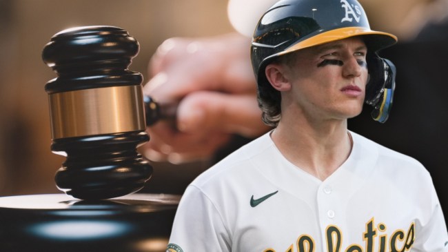 Athletics 3B Zack Gelof next to judge with a gavel