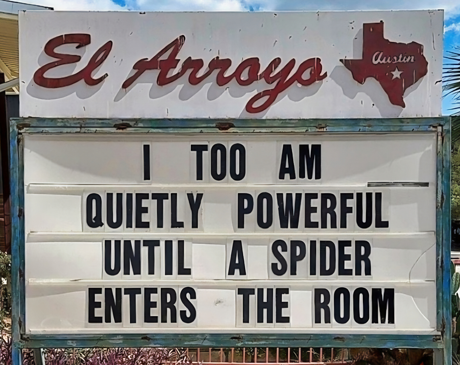 funny sign meme about spiders from the El Arroyo ATX sign in Austin