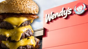Triple cheeseburger next to logo at Wendy's restaurant