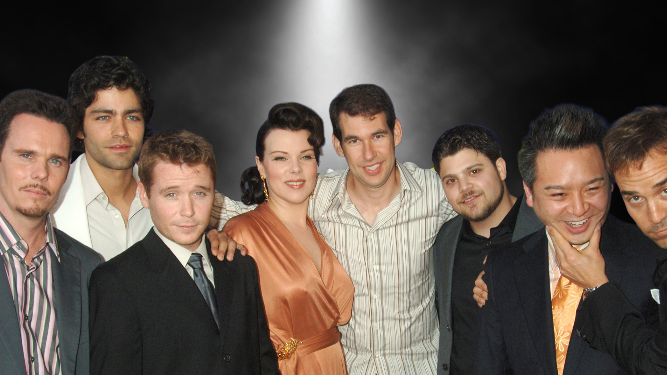 Entourage cast of Debi Mazar and Doug Elllin standing between the main actors