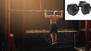 Gym bro doing pull-ups next to 25lb dumbbells used for lateral raise
