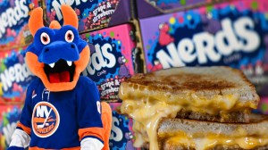 Islanders mascot Sparky next to grilled cheese and boxes of Nerds candy