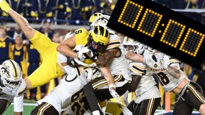 Michigan vs Western Michigan hail mary next to stadium clock reading zero