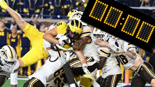 Michigan vs Western Michigan hail mary next to stadium clock reading zero