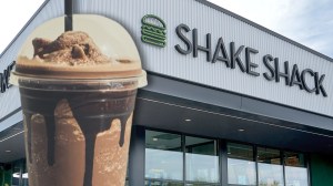 chocolate milkshake next to Shake Shack restaurant