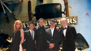 the cast of MythBusters standing in front of the original MythBusters sign