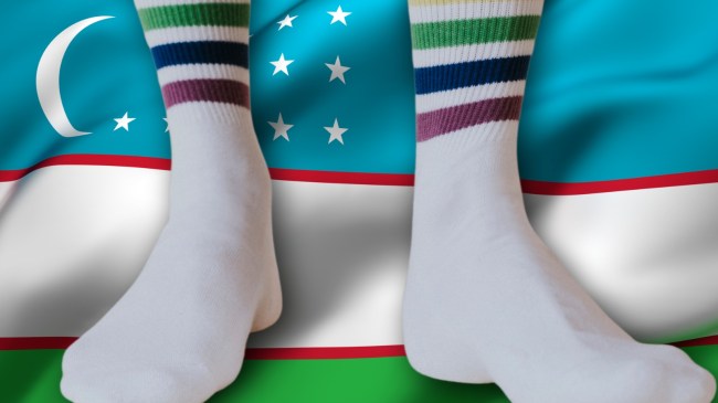 Person wearing tube socks over Uzbekistan flag