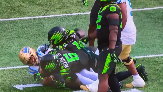 Oregon defensive tackle Bear Alexander appears to throw a punch at UCLA quarterback Nico Iamaleava during a Big Ten college football game on Oct. 10, 2026.