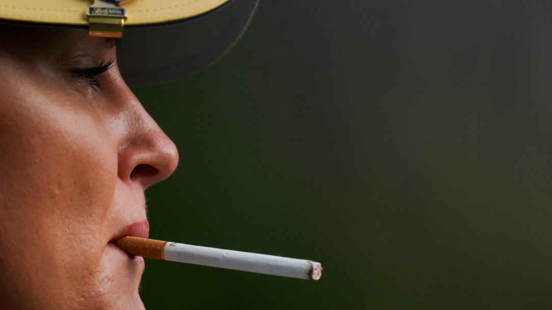 Charley-Hull-of-Team-Europe-smokes-a-cigarette-at-Solheim-Cup