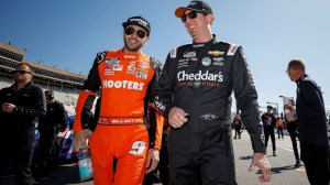 HAMPTON, GEORGIA - FEBRUARY 24: Chase Elliott, driver of the #9 Hooters Chevrolet, (L) and Kyle Busch, driver of the #8 Cheddar's Scratch Kitchen Chevrolet, talk on the grid during qualifying for the NASCAR Cup Series Ambetter Health 400 at Atlanta Motor Speedway on February 24, 2024 in Hampton, Georgia.
