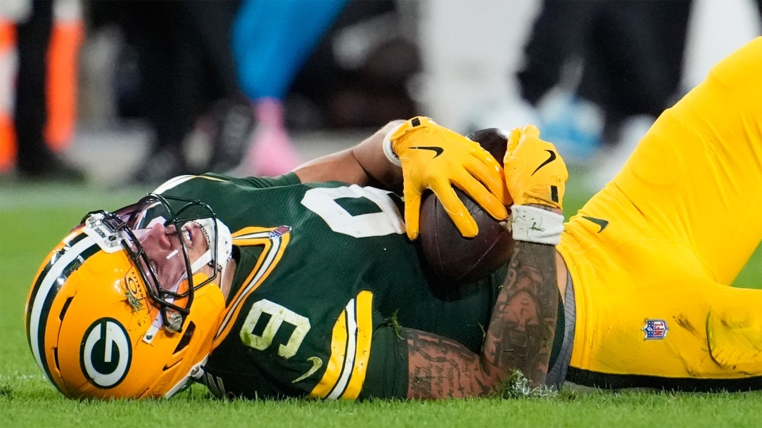 Green-Bay-Packers-wide-receiver-Christian-Watson-winces-in-pain