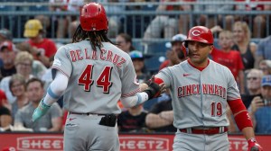 Aug 11, 2023; Pittsburgh, Pennsylvania, USA; Cincinnati Reds first baseman Joey Votto (19) greets shortstop Elly De La Cruz after Cruz scored a run against the Pittsburgh Pirates during the first inning at PNC Park.