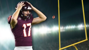 Virginia Tech kicker John Love next to field goal post