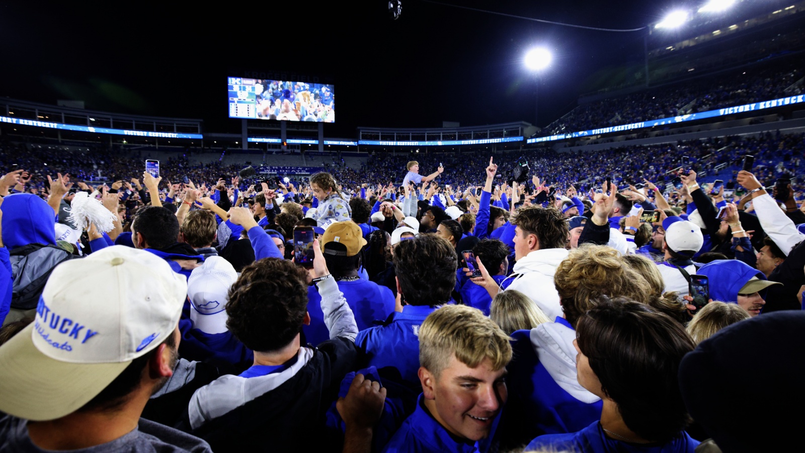 Kentucky fans storm the field. 